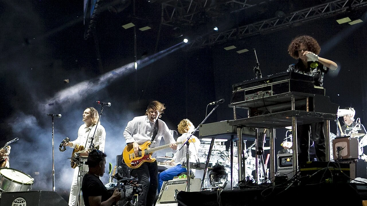 arcade fire 2026-2027 Tour & Schedule featuring arcade fire live on stage with stadium crowd