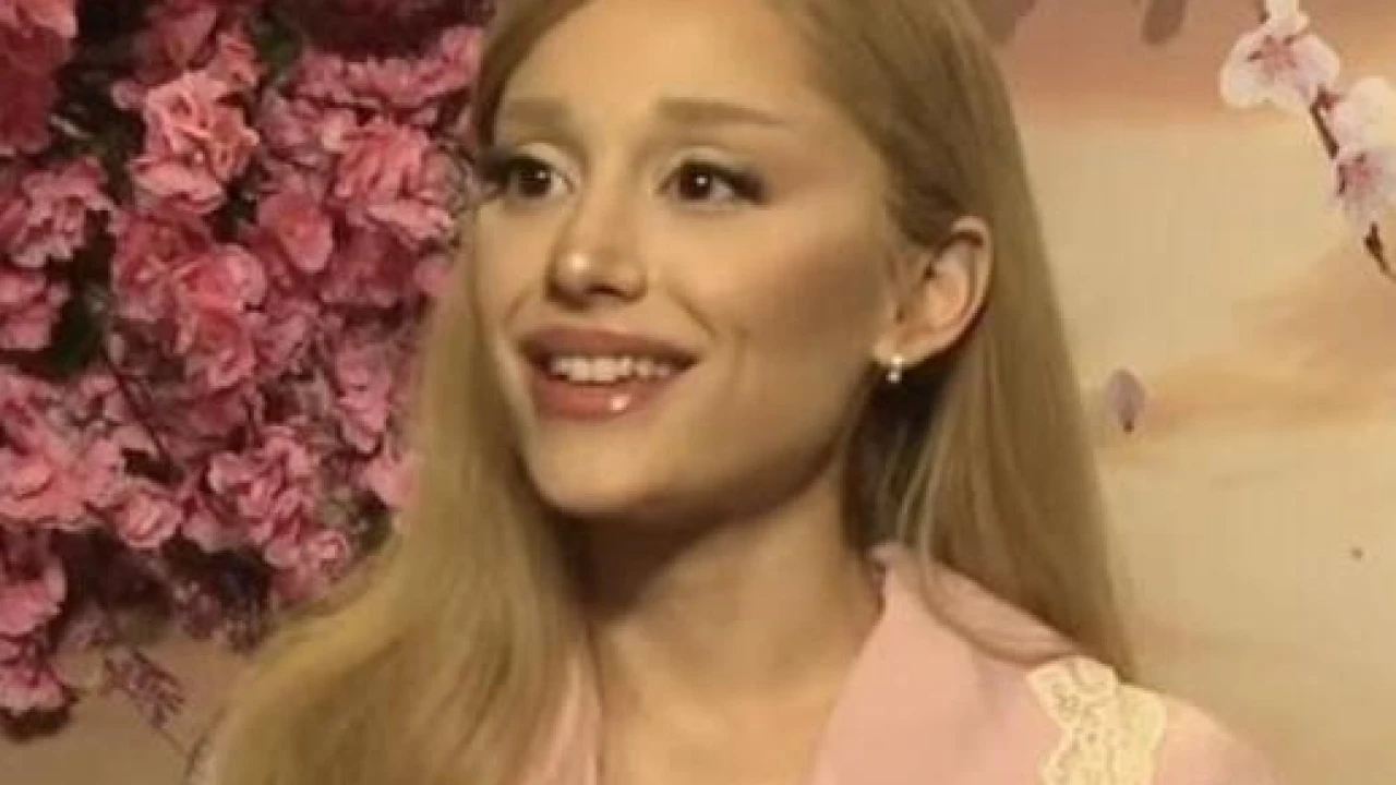 Ariana Grande 2026-2027 Tour & Schedule featuring Ariana Grande live on stage with stadium crowd