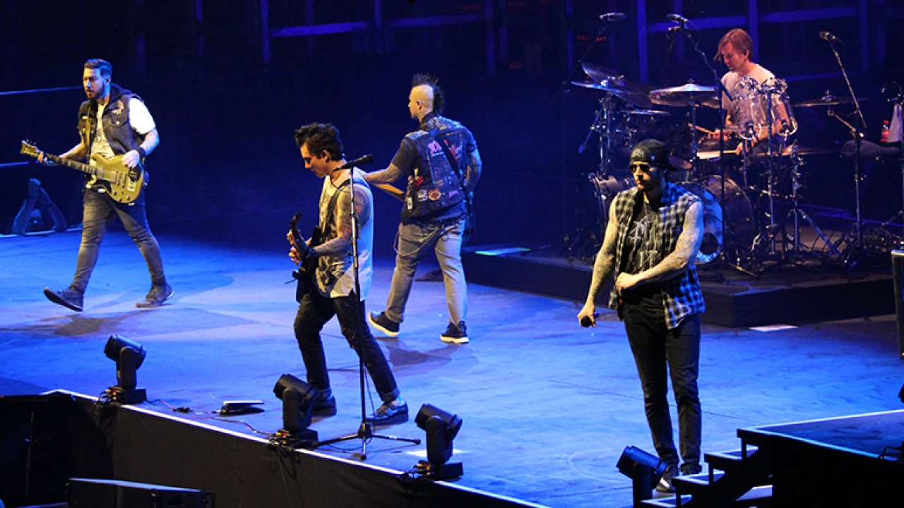 Avenged Sevenfold 2026-2027 Tour & Schedule featuring Avenged Sevenfold live on stage with stadium crowd