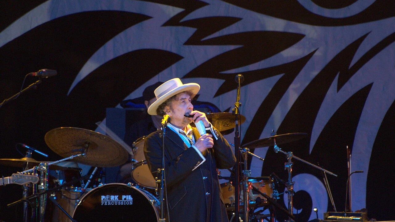 bob dylan 2026-2027 Tour & Schedule featuring bob dylan live on stage with stadium crowd