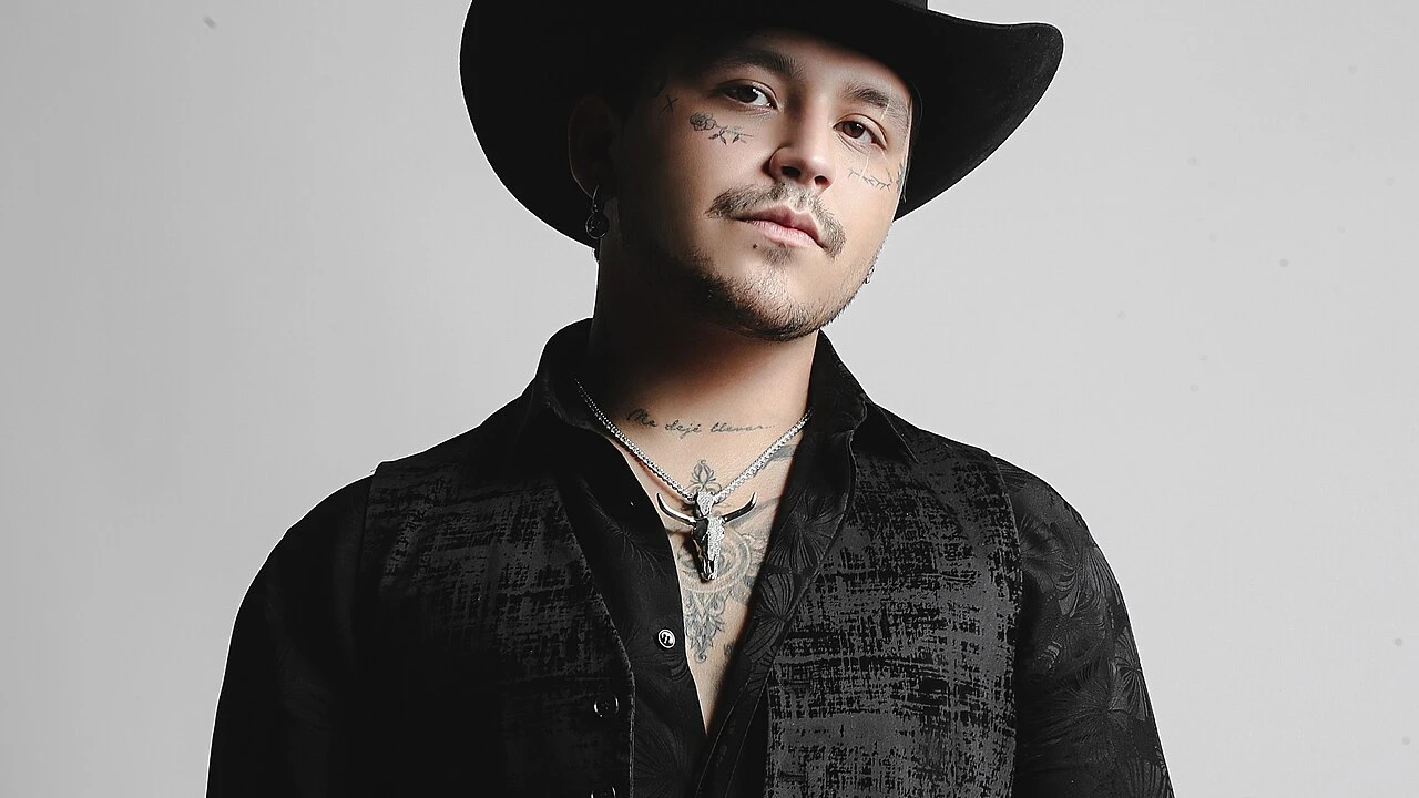 Christian Nodal 2026-2027 Tour & Schedule featuring Christian Nodal live on stage with stadium crowd