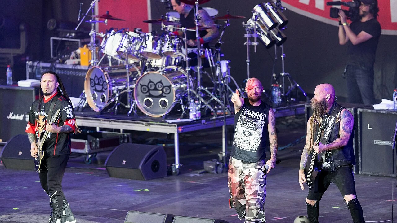 Five Finger Death Punch 2026-2027 Tour & Schedule featuring Five Finger Death Punch live on stage with stadium crowd