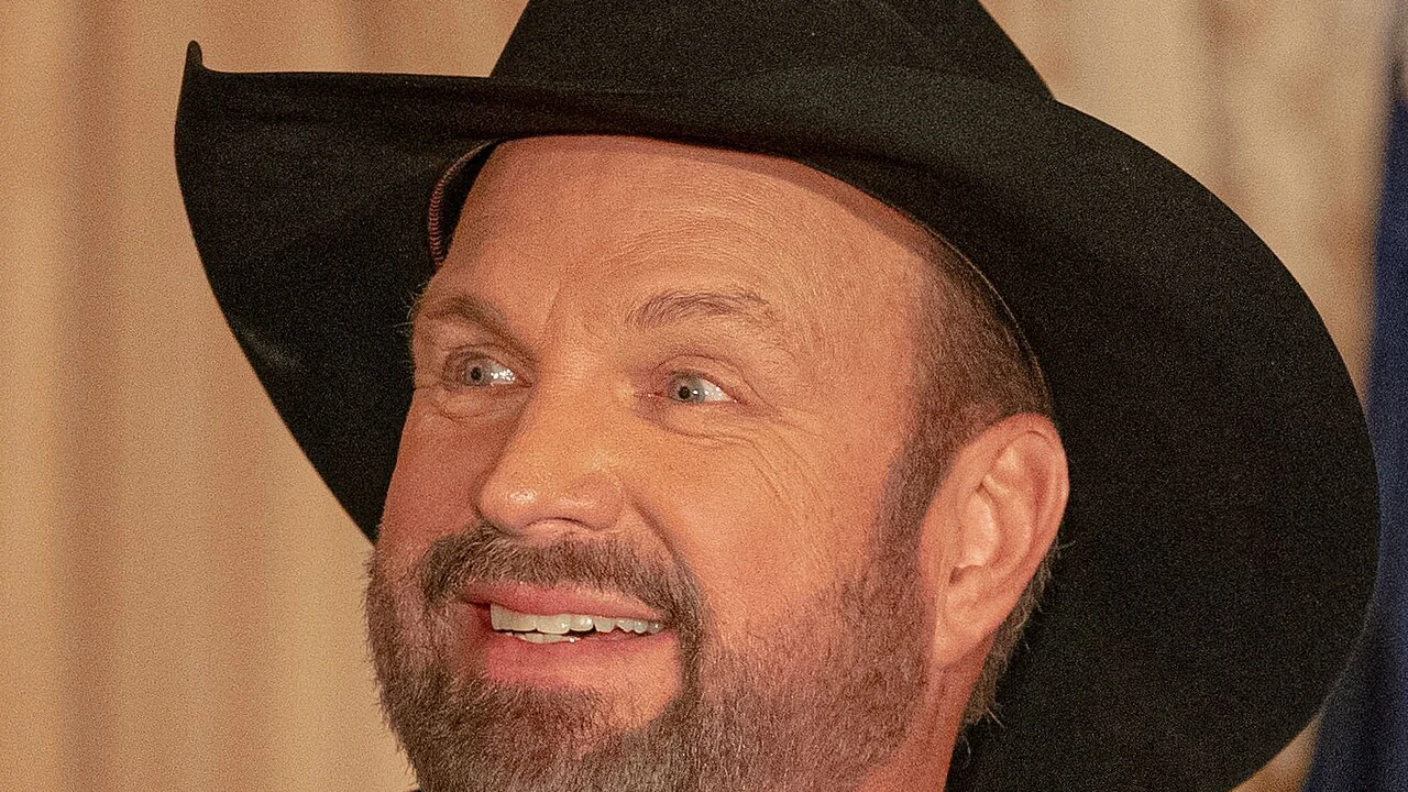 Garth Brooks 2026-2027 Tour & Schedule featuring Garth Brooks live on stage with stadium crowd