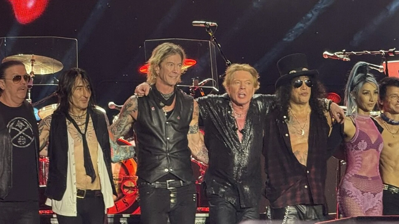 Guns N' Roses 2026-2027 Tour & Schedule featuring Guns N' Roses live on stage with stadium crowd
