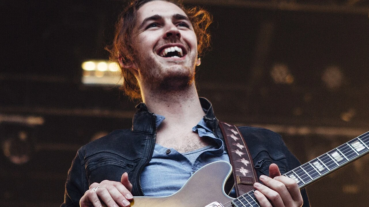 hozier 2026-2027 Tour & Schedule featuring hozier live on stage with stadium crowd