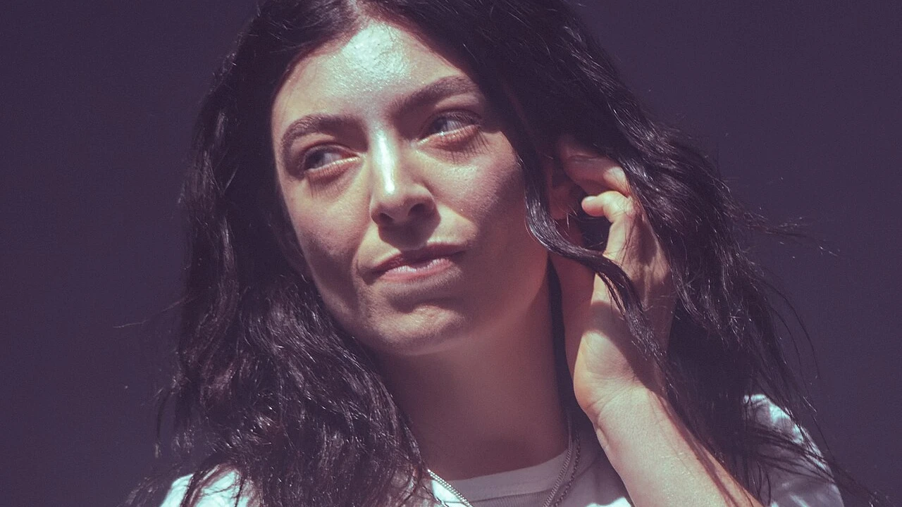 Lorde 2026-2027 Tour & Schedule featuring Lorde live on stage with stadium crowd