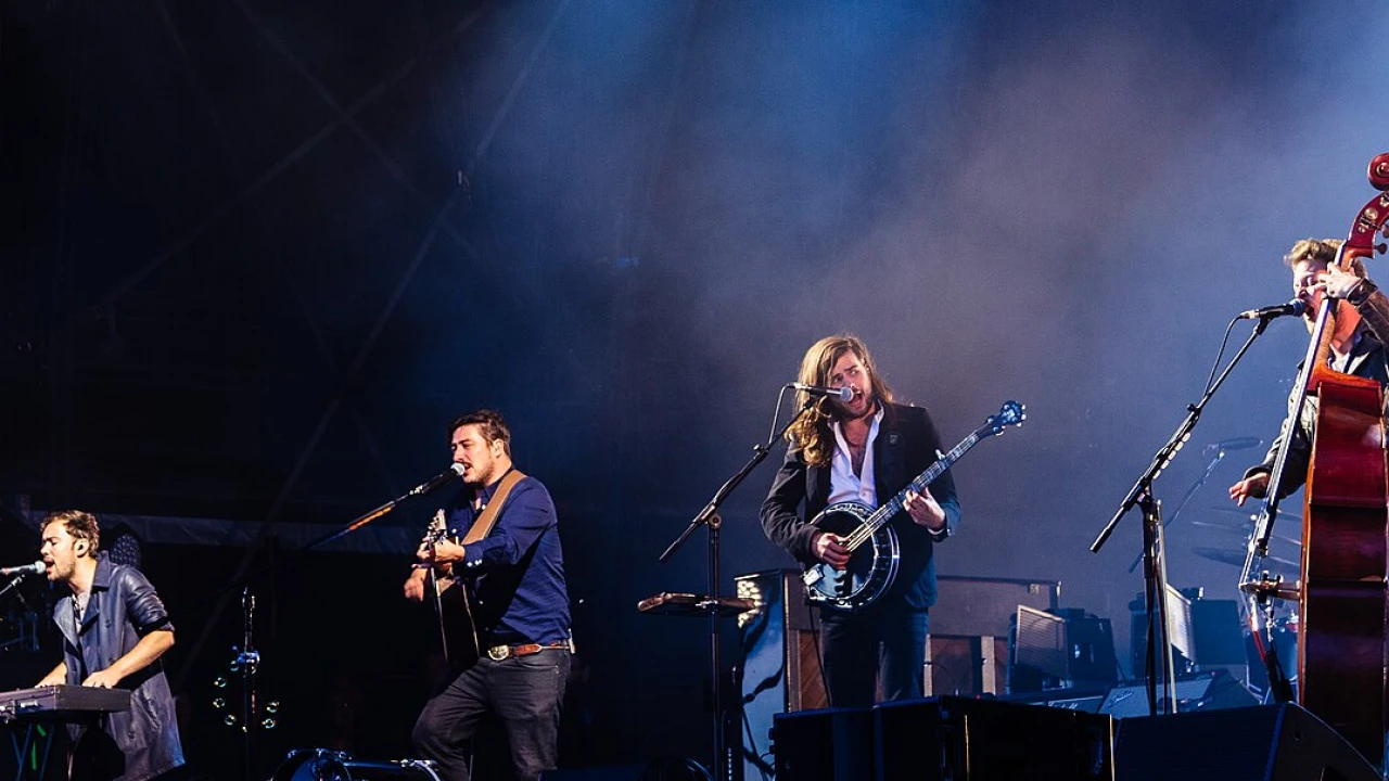 Mumford & Sons 2026-2027 Tour & Schedule featuring Mumford & Sons live on stage with stadium crowd