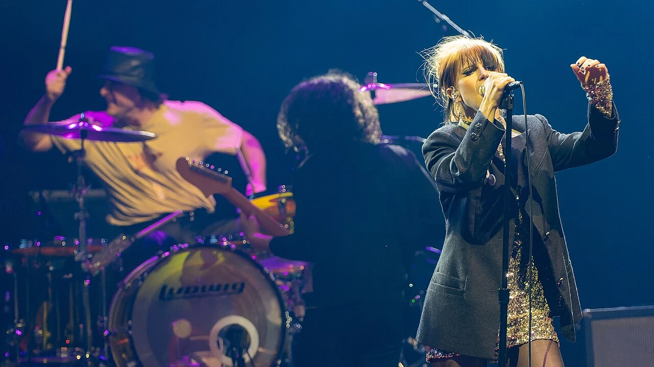 Paramore 2026-2027 Tour & Schedule featuring Paramore live on stage with stadium crowd