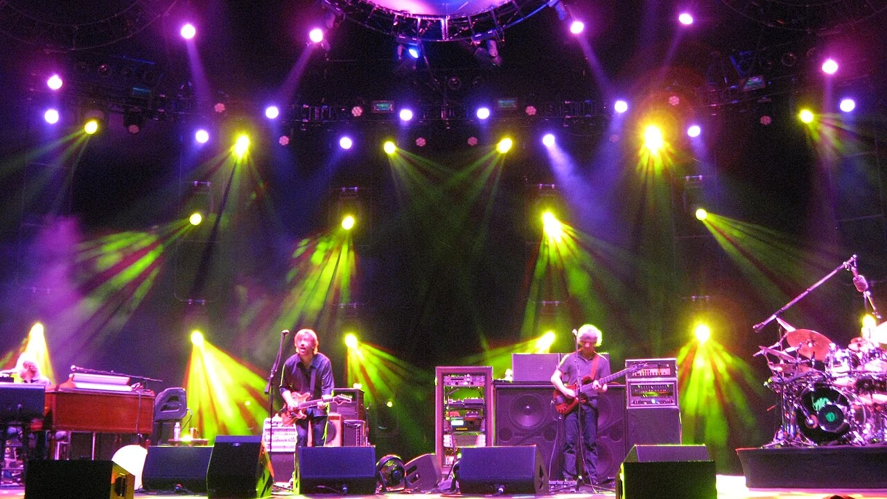 Phish 2026-2027 Tour & Schedule featuring Phish live on stage with stadium crowd