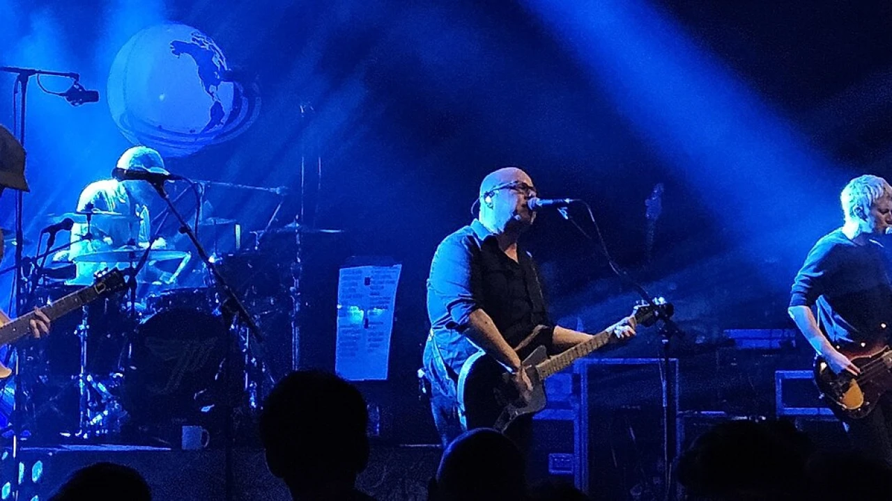 Pixies 2026-2027 Tour & Schedule featuring Pixies live on stage with stadium crowd