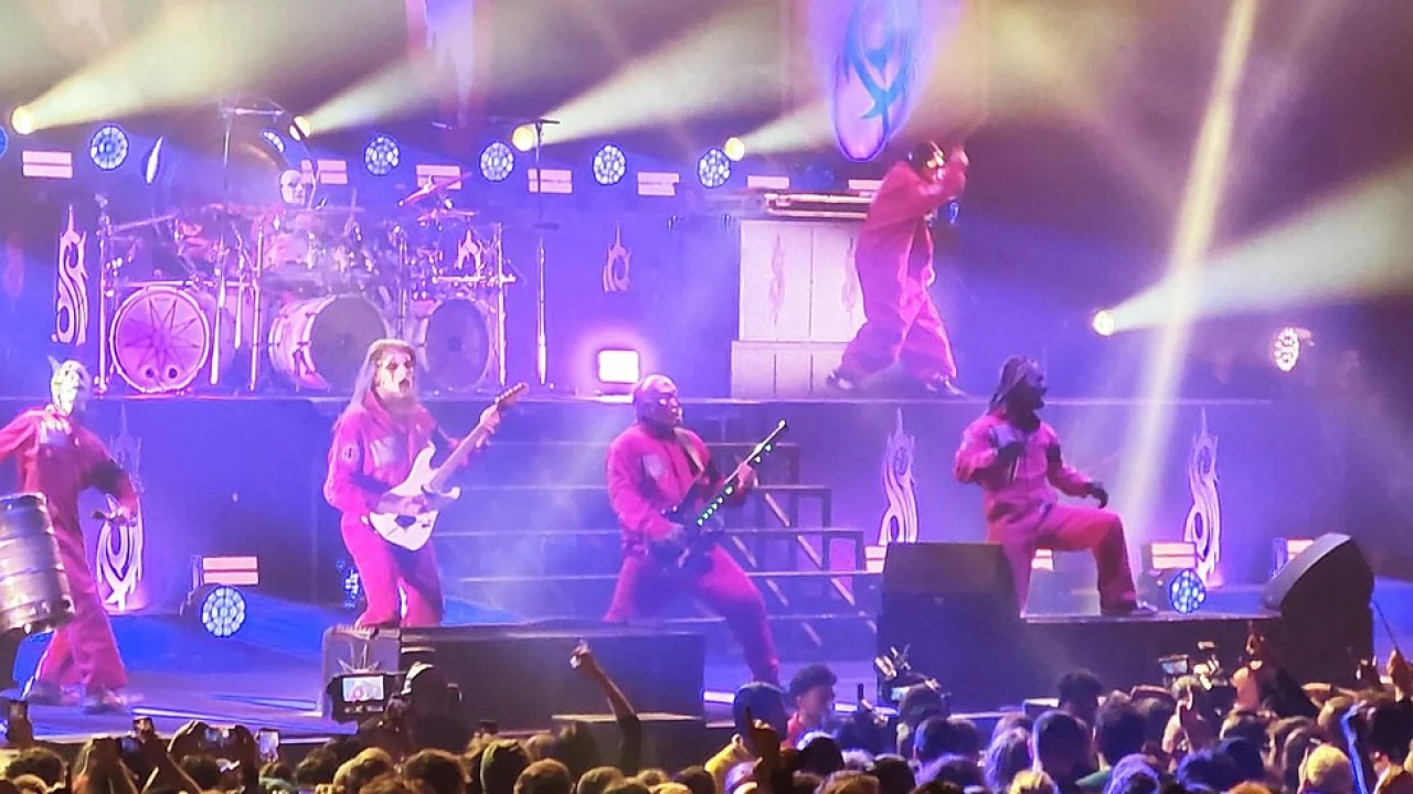 Slipknot 2026-2027 Tour & Schedule featuring Slipknot live on stage with stadium crowd