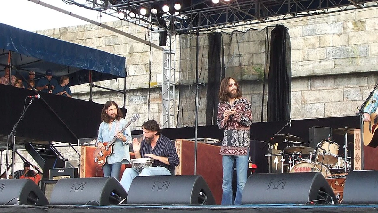 The Black Crowes 2026-2027 Tour & Schedule featuring The Black Crowes live on stage with stadium crowd